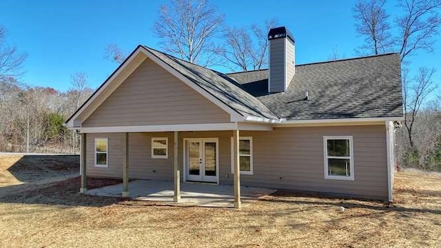 back of house with french doors and a patio