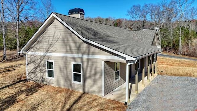 view of side of home with a patio