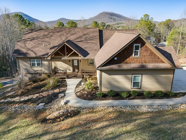 craftsman-style home featuring covered porch and a mountain view