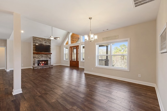 interior space featuring dark wood finished floors, a fireplace, visible vents, and a healthy amount of sunlight