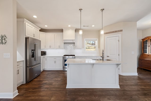 kitchen featuring a sink, light countertops, dark wood finished floors, and stainless steel appliances