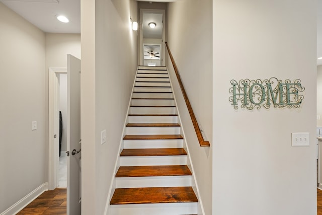 staircase with recessed lighting, baseboards, and wood finished floors