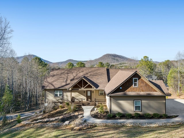 view of front of property with a porch and a mountain view