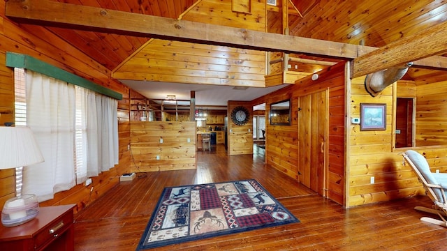 hall with wooden walls, wood ceiling, vaulted ceiling with beams, and wood-type flooring
