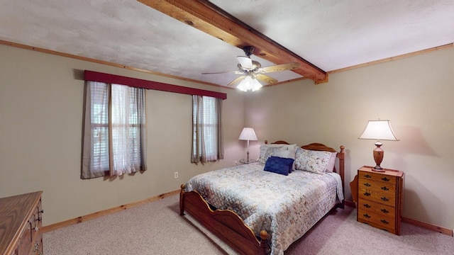 carpeted bedroom with baseboards, ceiling fan, and beam ceiling
