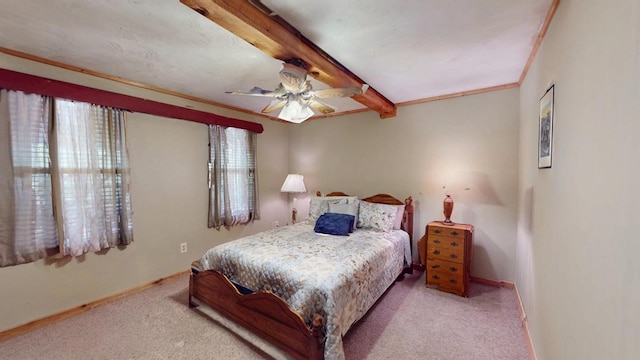 carpeted bedroom featuring baseboards, beamed ceiling, and a ceiling fan
