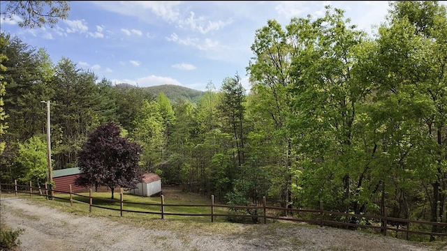 mountain view featuring a view of trees
