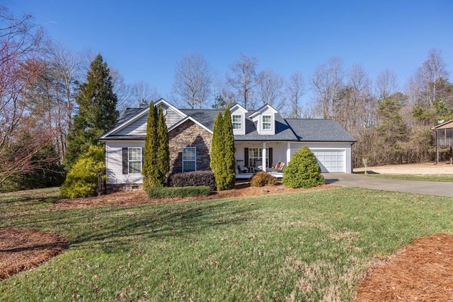 cape cod home featuring a front yard, a garage, and a porch