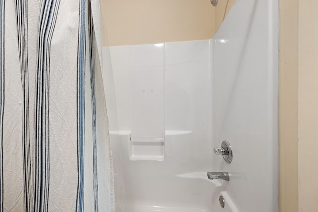 bathroom featuring  shower combination