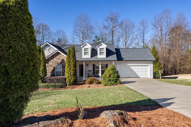 cape cod home with a front yard, a garage, and covered porch