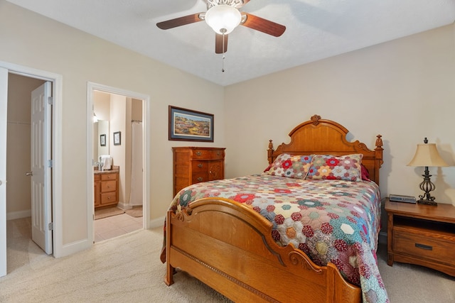 carpeted bedroom featuring ceiling fan and connected bathroom