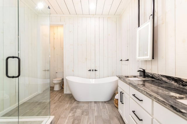 full bathroom with wooden ceiling, a shower stall, wood finished floors, and vanity