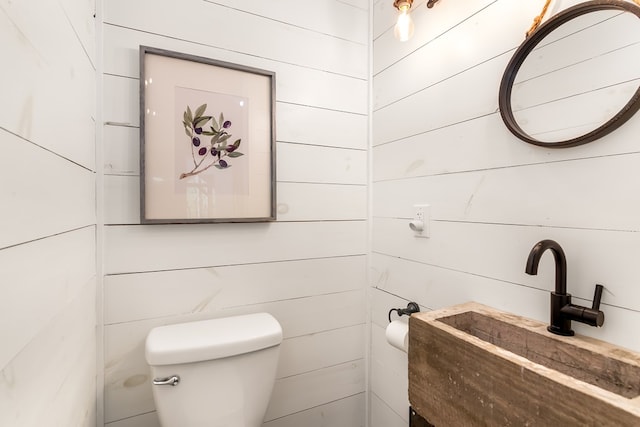 half bath with a sink and toilet