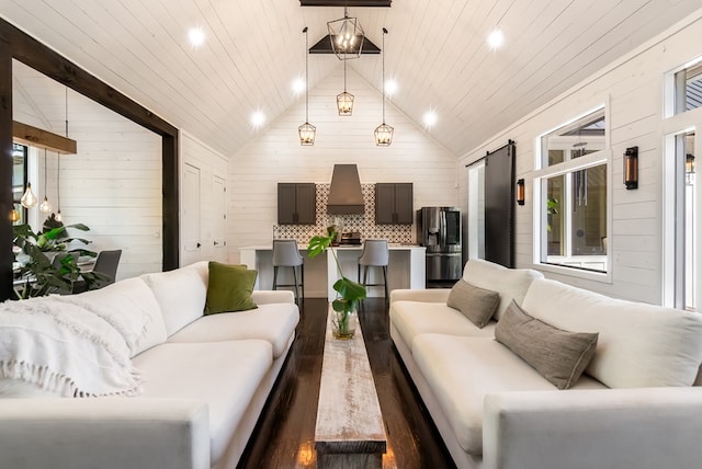 living room with recessed lighting, high vaulted ceiling, wood walls, and dark wood-type flooring