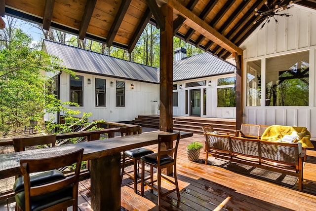 wooden deck with an outdoor living space and outdoor dining space