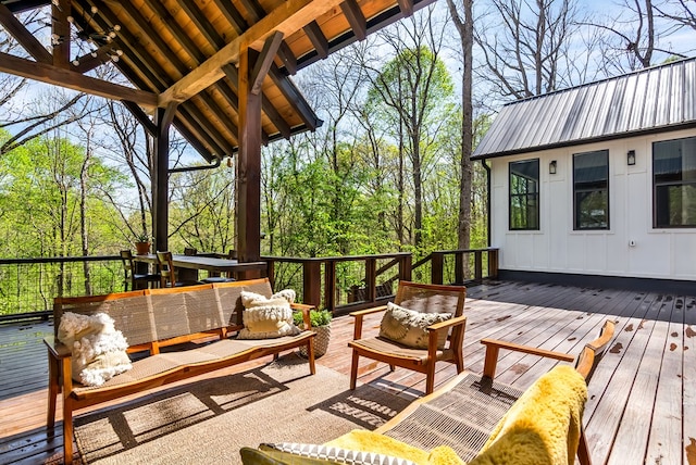 wooden deck with an outdoor living space