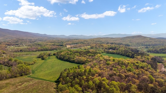 aerial view with a mountain view and a wooded view