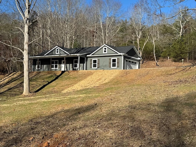 view of front facade with a front lawn and a garage