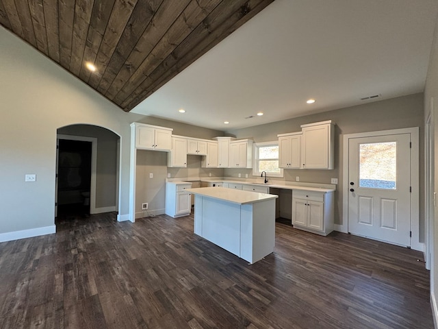 kitchen featuring white cabinets, plenty of natural light, and a center island