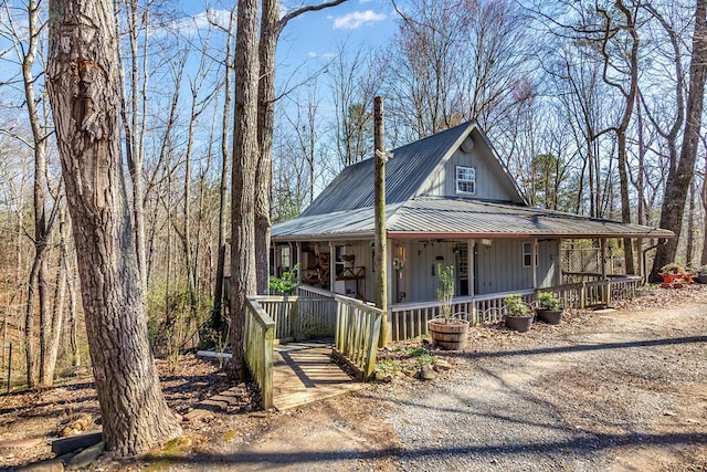 1575 Old Burnt Mountain Rd, Jasper, GA 30143 - view of front of house with a porch, metal roof, and board and batten siding
