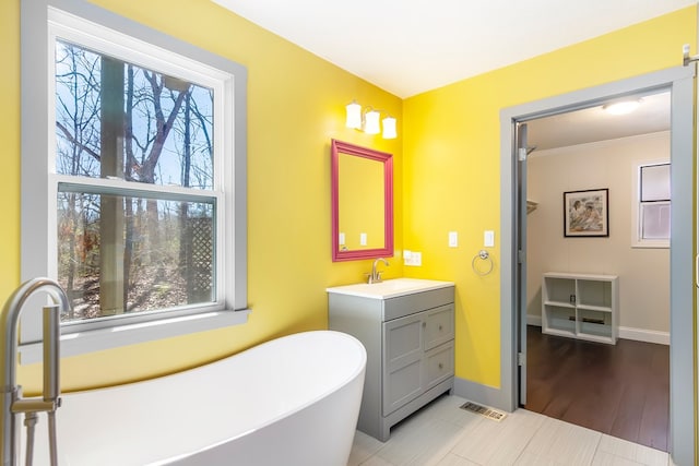 1575 Old Burnt Mountain Rd, Jasper, GA 30143 - full bath featuring a soaking tub, vanity, plenty of natural light, and baseboards