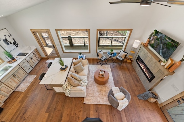 366 Three Oaks Dr, Morganton, GA 30559 - living room featuring a tiled fireplace, a ceiling fan, vaulted ceiling, and wood finished floors