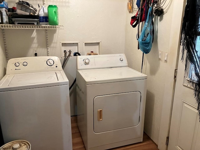 washroom featuring washer and clothes dryer and hardwood / wood-style floors