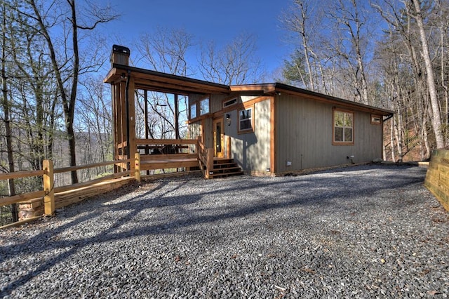 rear view of house with a deck