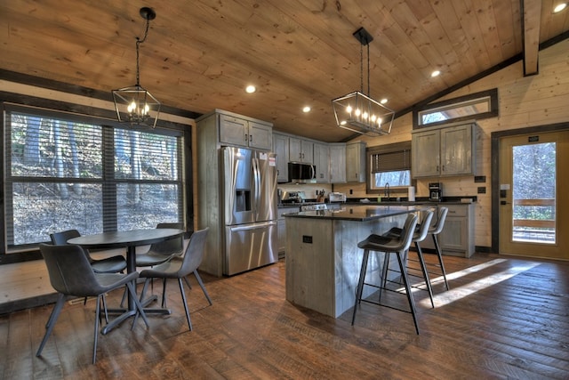 kitchen featuring stainless steel appliances, pendant lighting, wooden ceiling, dark hardwood / wood-style floors, and a kitchen island