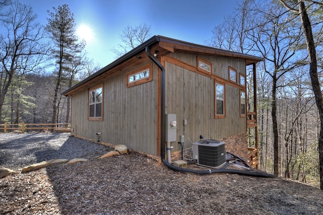 view of side of home with cooling unit