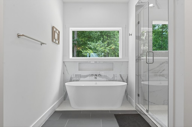 897 Faraday Dr, Ellijay, GA 30540 - full bathroom featuring healthy amount of natural light, a freestanding tub, a marble finish shower, and tile patterned flooring