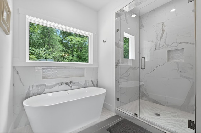 897 Faraday Dr, Ellijay, GA 30540 - bathroom featuring healthy amount of natural light, a soaking tub, and a marble finish shower