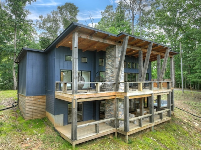 897 Faraday Dr, Ellijay, GA 30540 - back of house featuring stone siding and a balcony