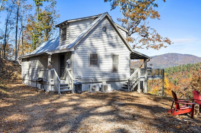 back of house featuring a mountain view