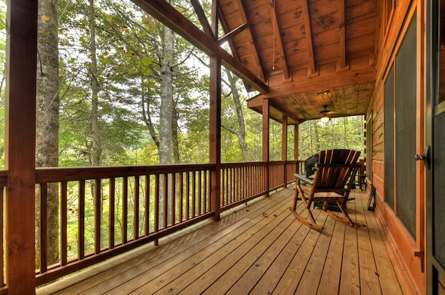 unfurnished sunroom featuring lofted ceiling with beams and wood ceiling