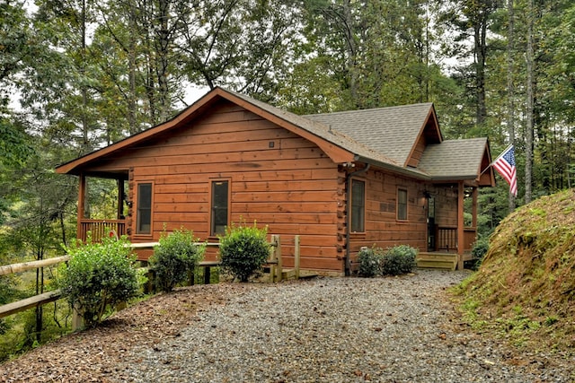 view of side of property with a porch