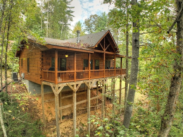 back of house featuring a wooden deck