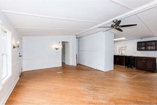 unfurnished living room with wood finished floors