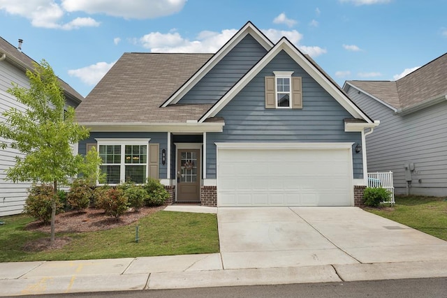 view of front of house with concrete driveway, a front yard, and brick siding