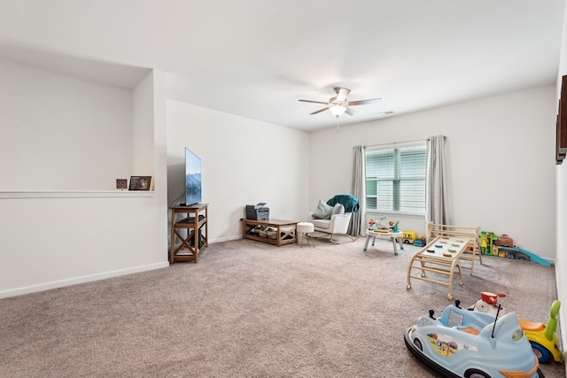 rec room featuring baseboards, carpet flooring, and ceiling fan