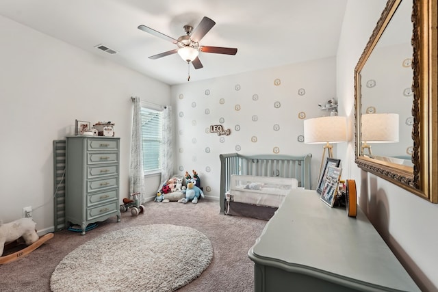 bedroom with baseboards, ceiling fan, carpet flooring, and visible vents