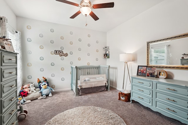 carpeted bedroom featuring baseboards and ceiling fan