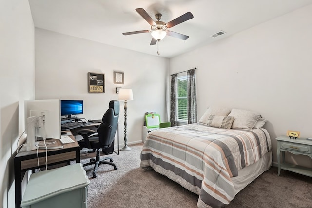 carpeted bedroom with visible vents, baseboards, and ceiling fan