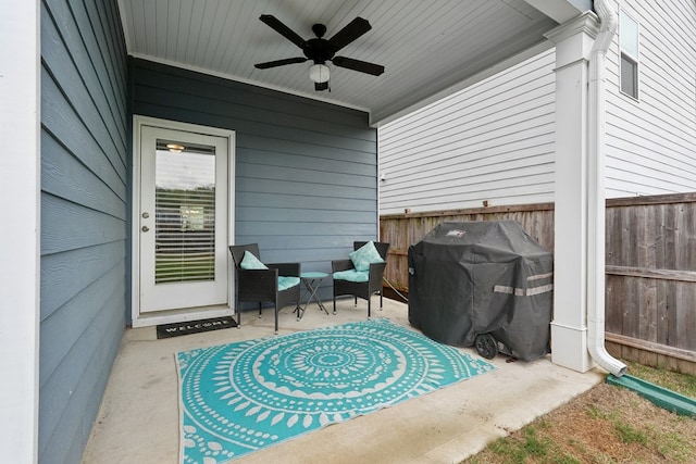 view of patio featuring fence, a ceiling fan, and grilling area