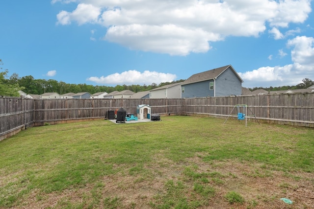 view of yard with a fenced backyard