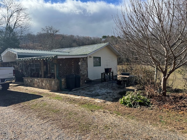 view of home's exterior with a patio