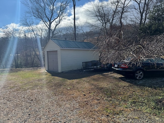 garage featuring a yard