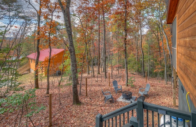 view of yard with a fire pit