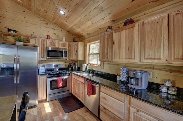 kitchen featuring sink, stainless steel appliances, dark stone counters, vaulted ceiling, and wood ceiling