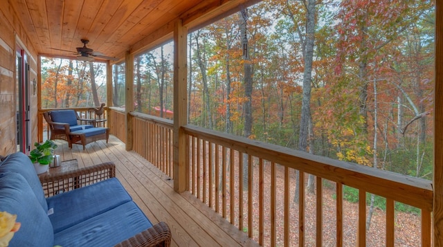 wooden deck featuring ceiling fan